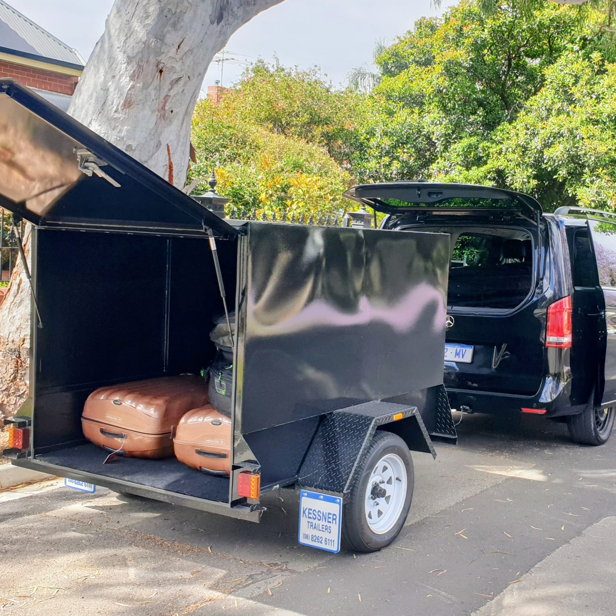 Dedicated luggage trailer alongside Mercedes Sprinter